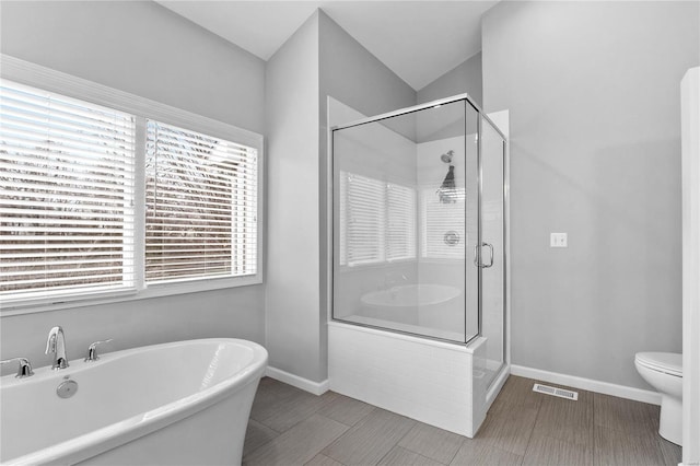 bathroom with separate shower and tub and toilet