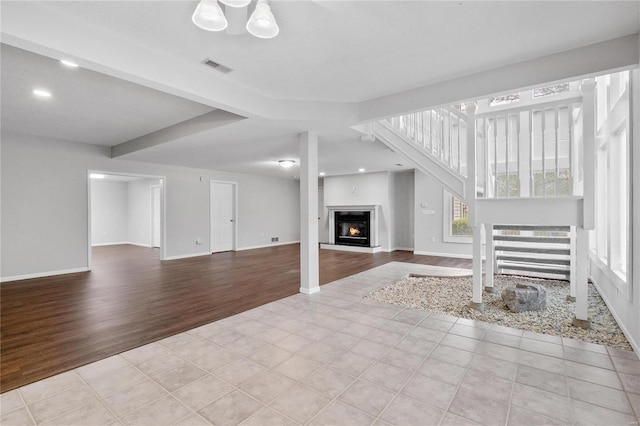 unfurnished living room featuring light tile patterned floors