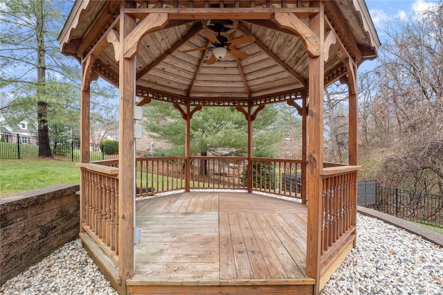 wooden deck with a gazebo and ceiling fan