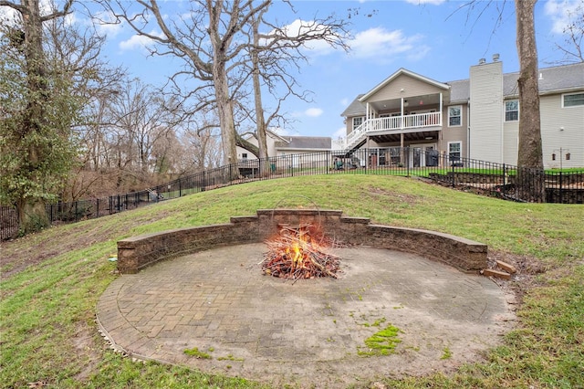 view of yard with a patio and an outdoor fire pit