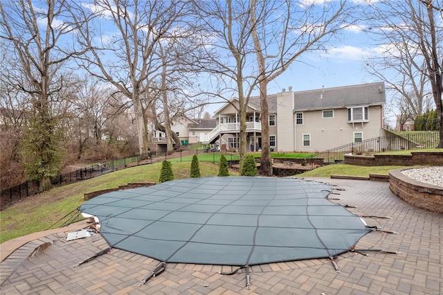 view of swimming pool with a lawn and a patio area