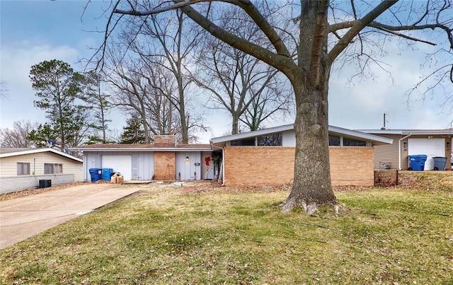 ranch-style house with a garage and a front yard