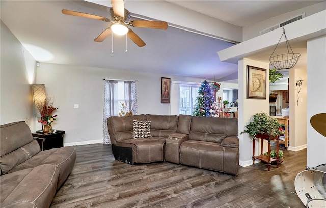 living room with ceiling fan and dark hardwood / wood-style flooring