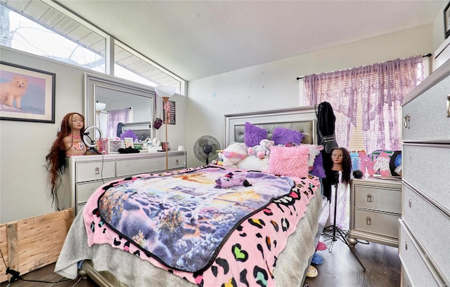 bedroom with dark hardwood / wood-style flooring and vaulted ceiling