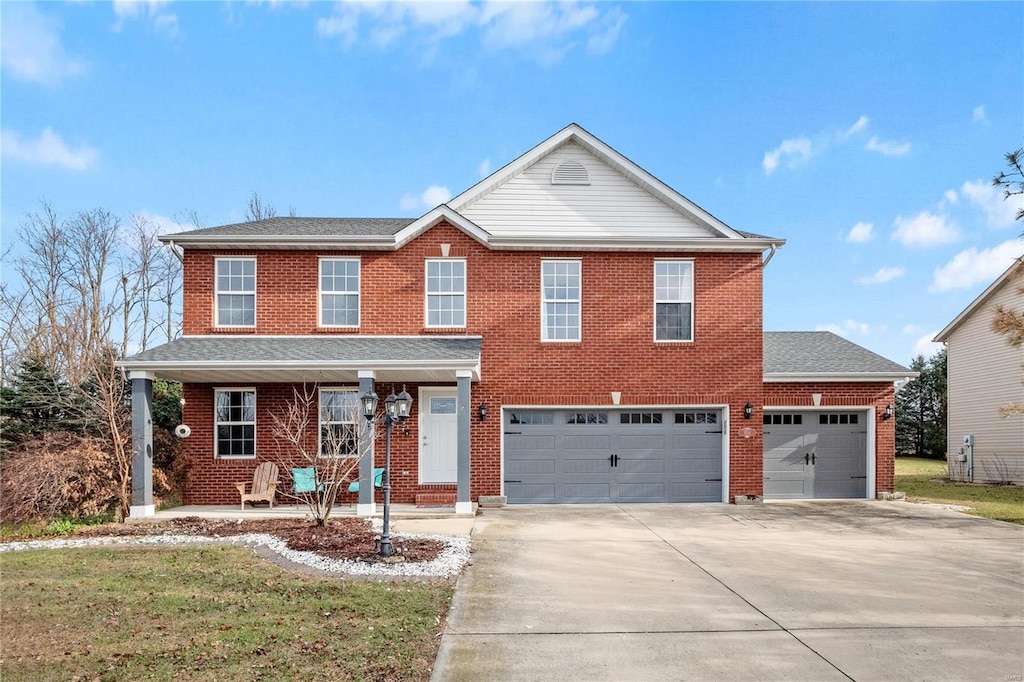 view of front facade featuring a front lawn and a garage