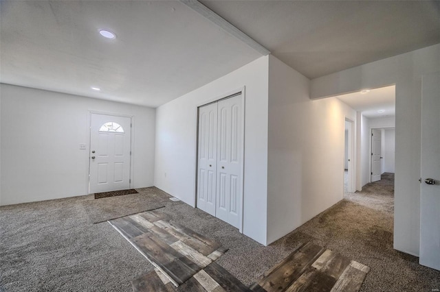 view of carpeted entrance foyer