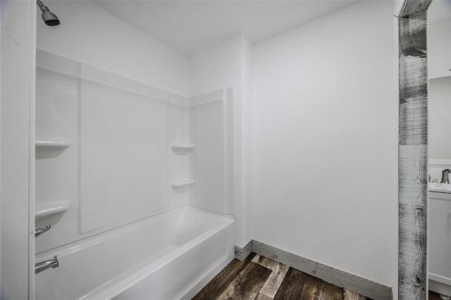 bathroom featuring shower / bathtub combination and wood-type flooring