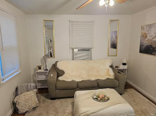 living room with ceiling fan, cooling unit, and wood-type flooring