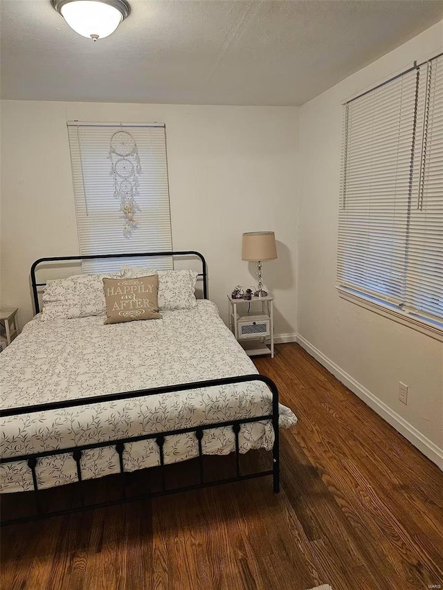 bedroom featuring dark hardwood / wood-style floors