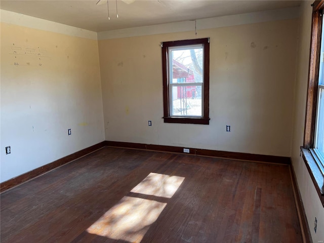 empty room with dark hardwood / wood-style floors