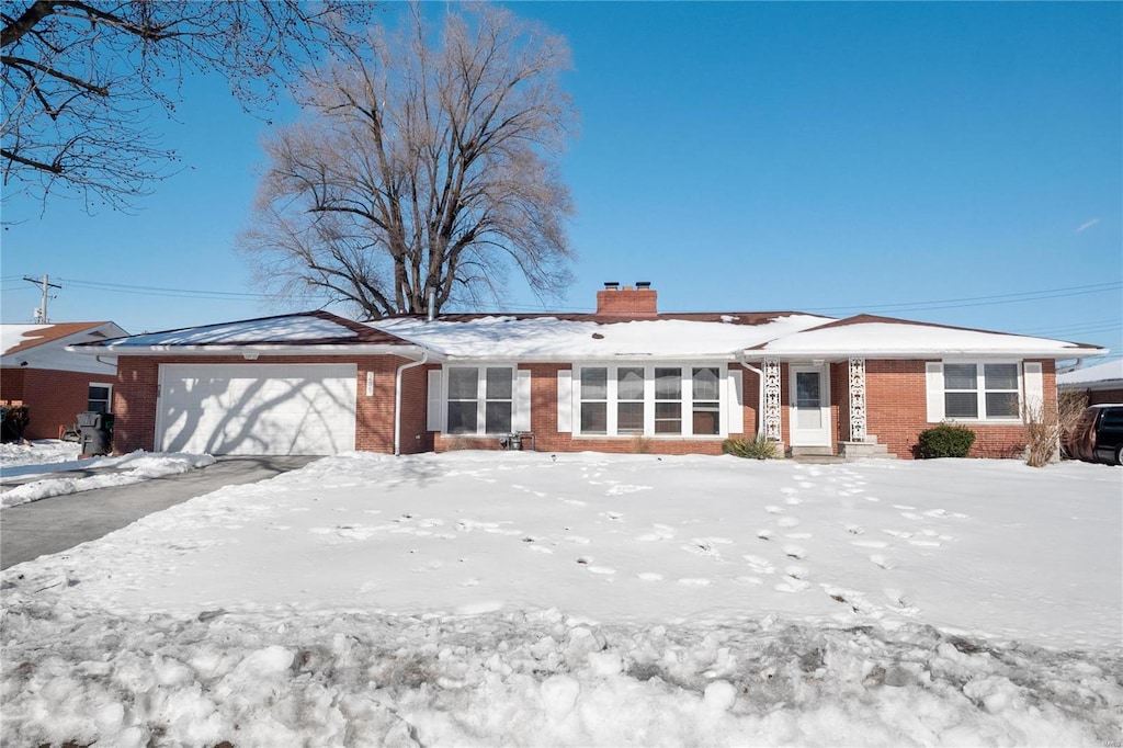 single story home featuring a garage