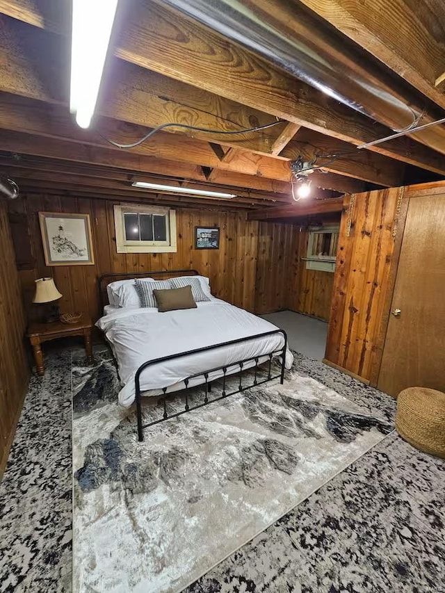 bedroom featuring wooden walls