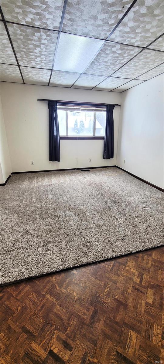 spare room with parquet flooring