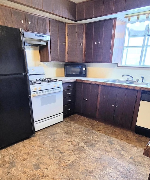 kitchen with dark brown cabinets, sink, and black appliances