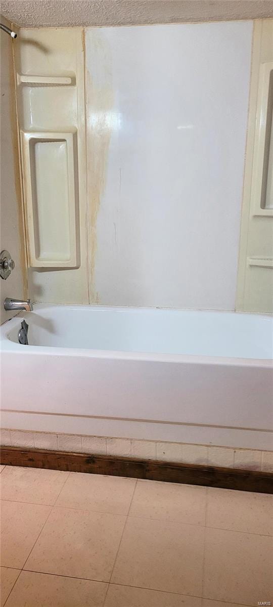 bathroom featuring tile patterned floors and shower / bathing tub combination