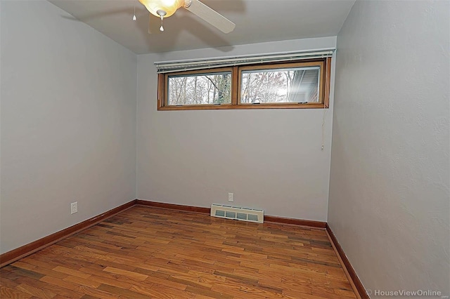 empty room featuring hardwood / wood-style floors and ceiling fan