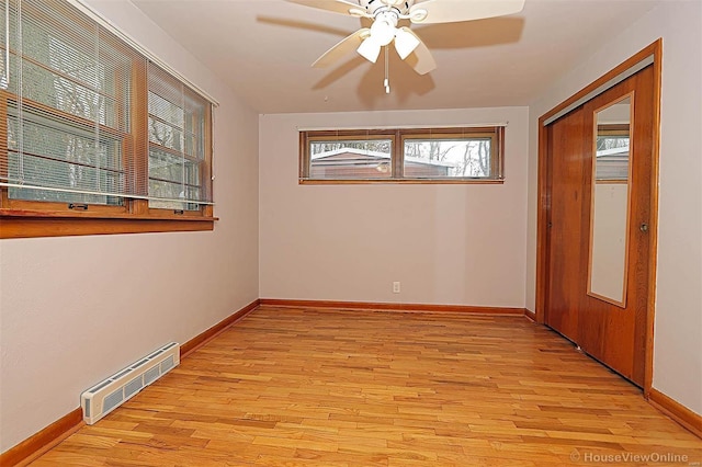 unfurnished room with ceiling fan and light hardwood / wood-style flooring