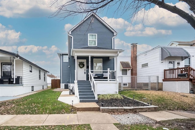 bungalow-style house featuring a front yard and a porch