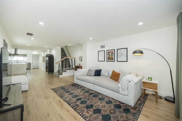 living room with light hardwood / wood-style floors