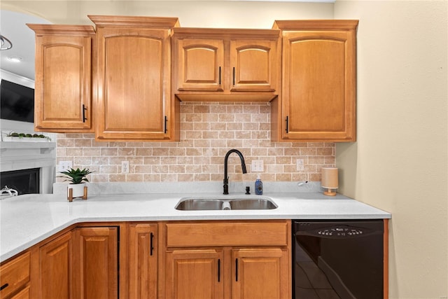 kitchen with decorative backsplash, sink, and black dishwasher