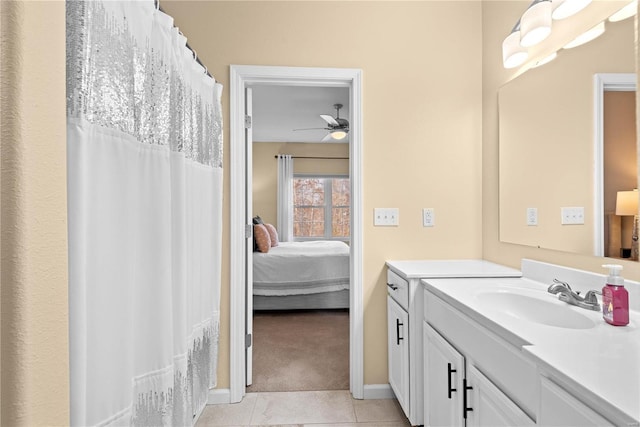 bathroom with tile patterned floors, ceiling fan, and vanity