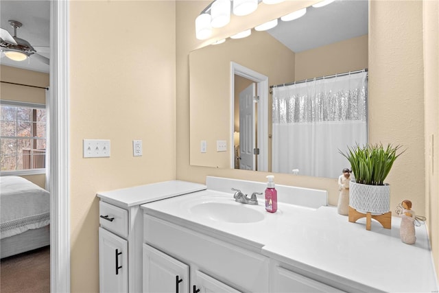 bathroom with ceiling fan and vanity