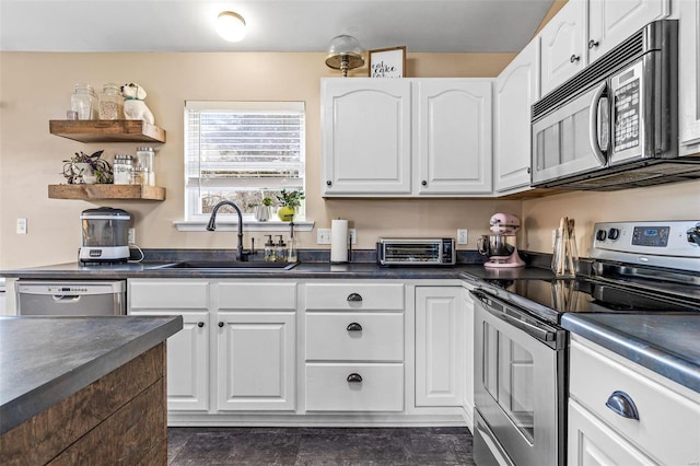 kitchen with white cabinetry, sink, and appliances with stainless steel finishes