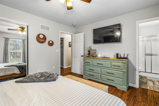 bedroom with connected bathroom, ceiling fan, and dark wood-type flooring