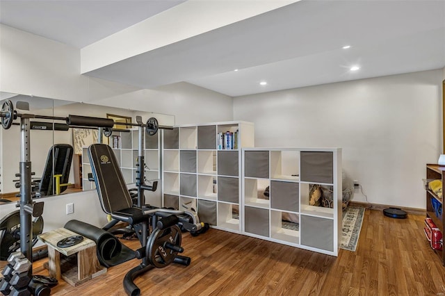 workout room with hardwood / wood-style floors