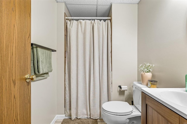 bathroom featuring tile patterned flooring, vanity, and toilet