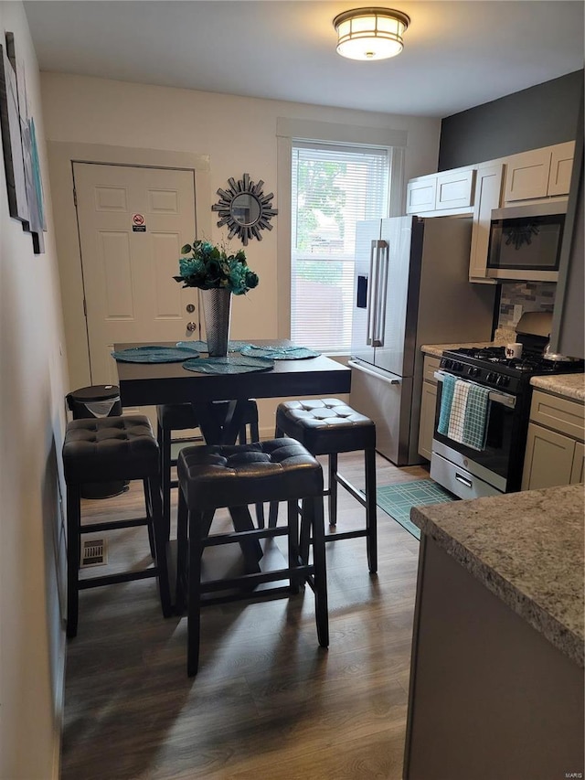 dining area featuring dark hardwood / wood-style flooring