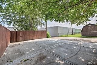 view of patio / terrace with an outbuilding