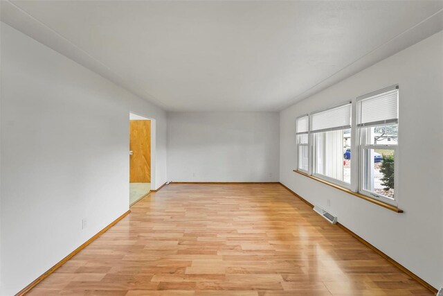 empty room featuring light hardwood / wood-style floors