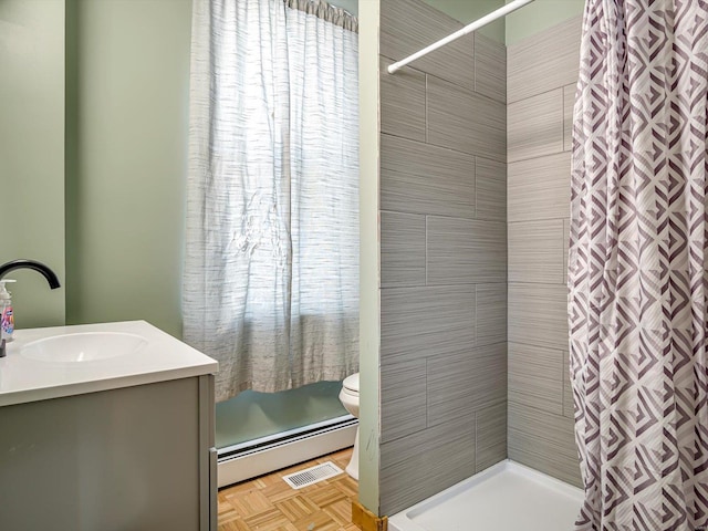 bathroom with a baseboard heating unit, toilet, a shower with shower curtain, and visible vents