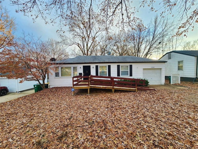 ranch-style house featuring a garage