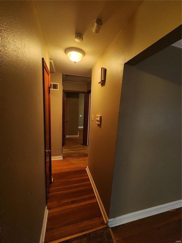 hall featuring dark hardwood / wood-style flooring