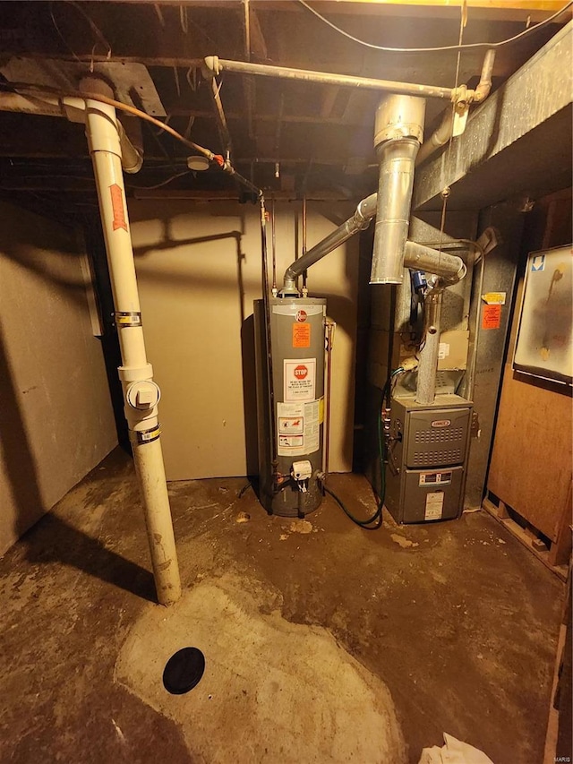 utility room with heating unit and gas water heater