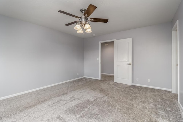 spare room with light carpet and ceiling fan