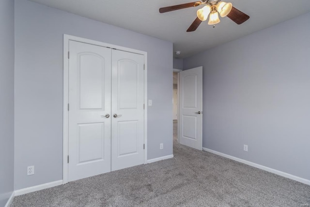 unfurnished bedroom with light carpet, a closet, and ceiling fan