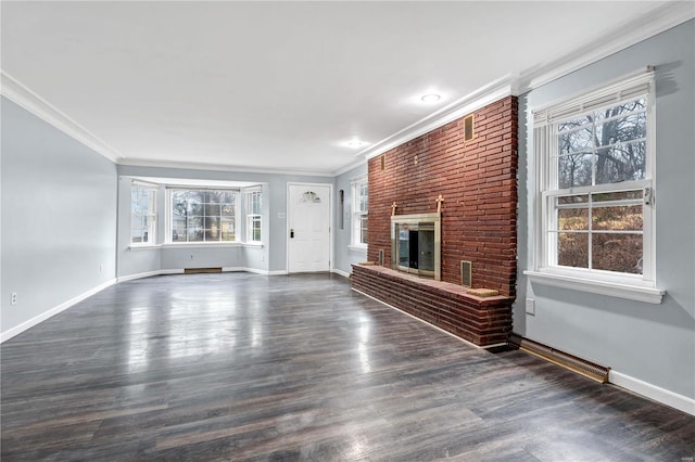 unfurnished living room featuring a fireplace, dark hardwood / wood-style floors, and crown molding