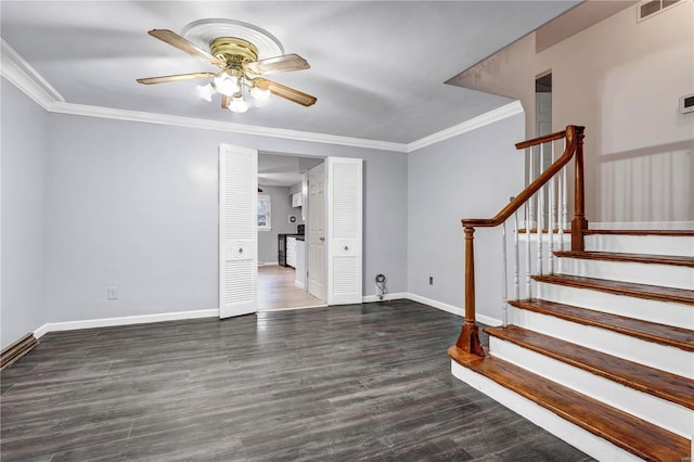 interior space featuring ceiling fan, crown molding, and dark wood-type flooring