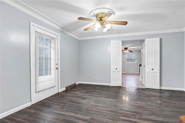 spare room featuring dark hardwood / wood-style flooring and ornamental molding