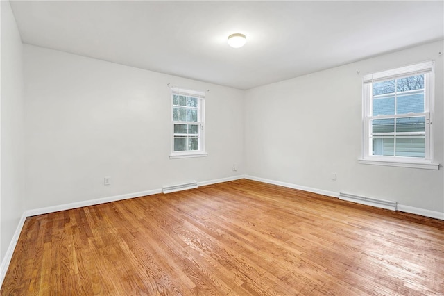 unfurnished room featuring light wood-type flooring