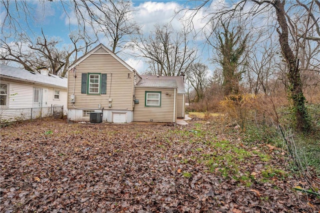 back of property featuring central air condition unit