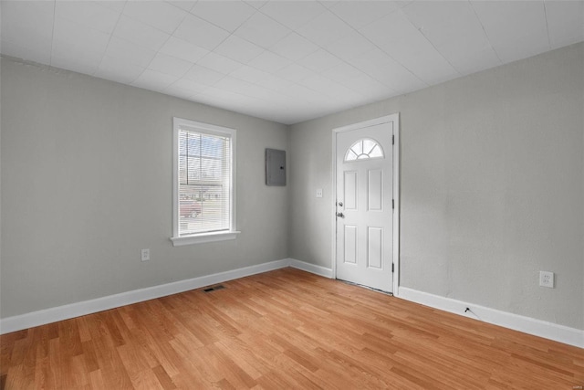 entrance foyer with light wood-type flooring and electric panel