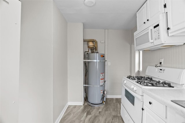 kitchen with secured water heater, light wood-type flooring, white appliances, and white cabinets