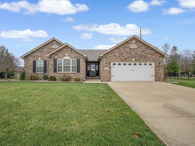 ranch-style house featuring a front yard and a garage