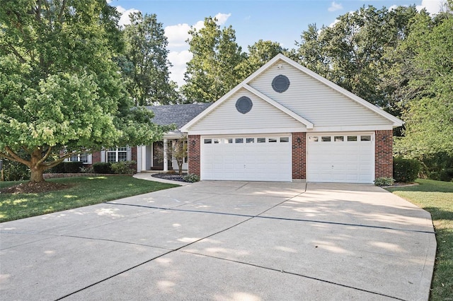 view of front of house featuring a front lawn and a garage