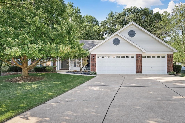 view of front facade with a front yard and a garage