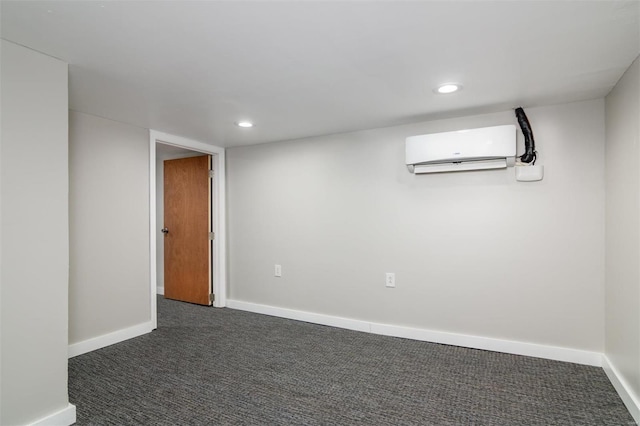 basement featuring an AC wall unit and dark colored carpet